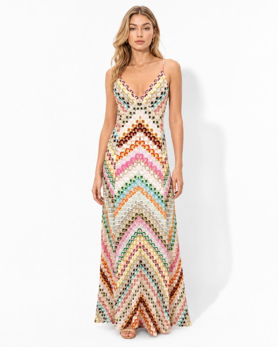 Front view of a woman modeling the Ondara pink multicolor chevron knit halter maxi dress.