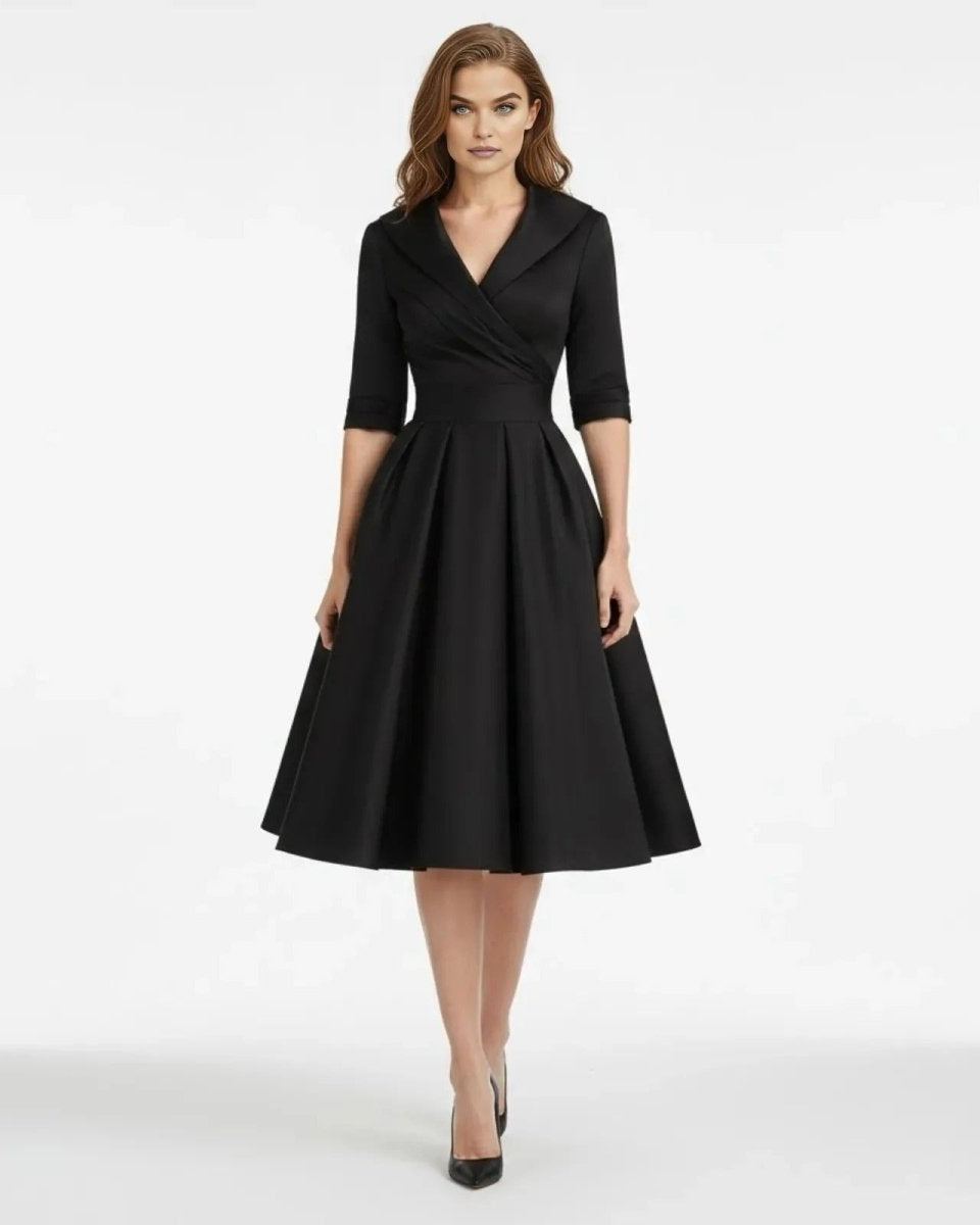 Woman wearing a black dress on a white background