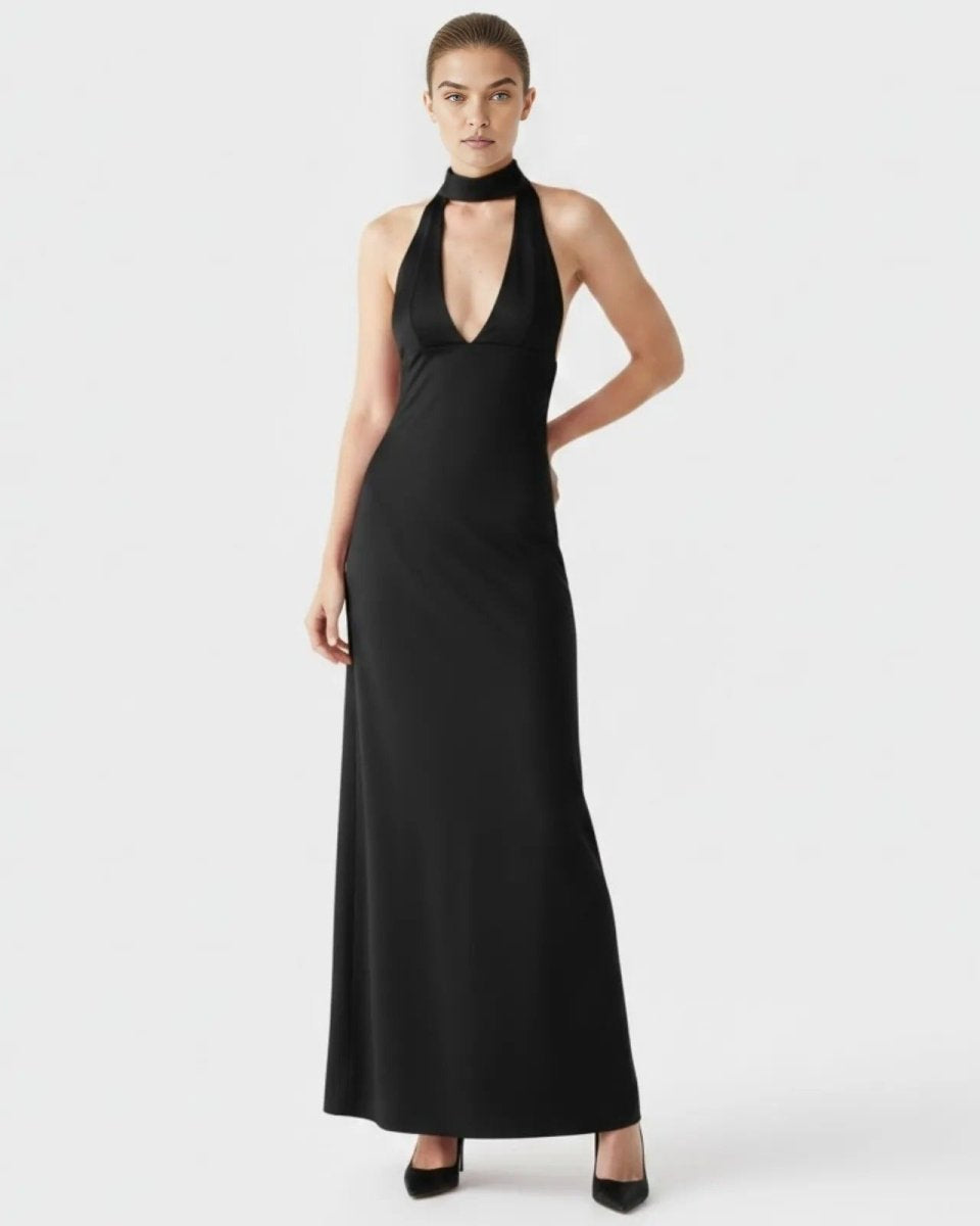 Front view of model wearing Ondara luxury cornflower blue halter maxi gown with deep plunge neckline.