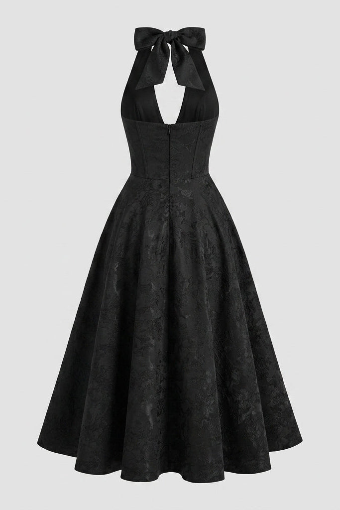 Back ghost mannequin view of the black halter neck wedding guest dress, showing the hidden zipper and open back design.