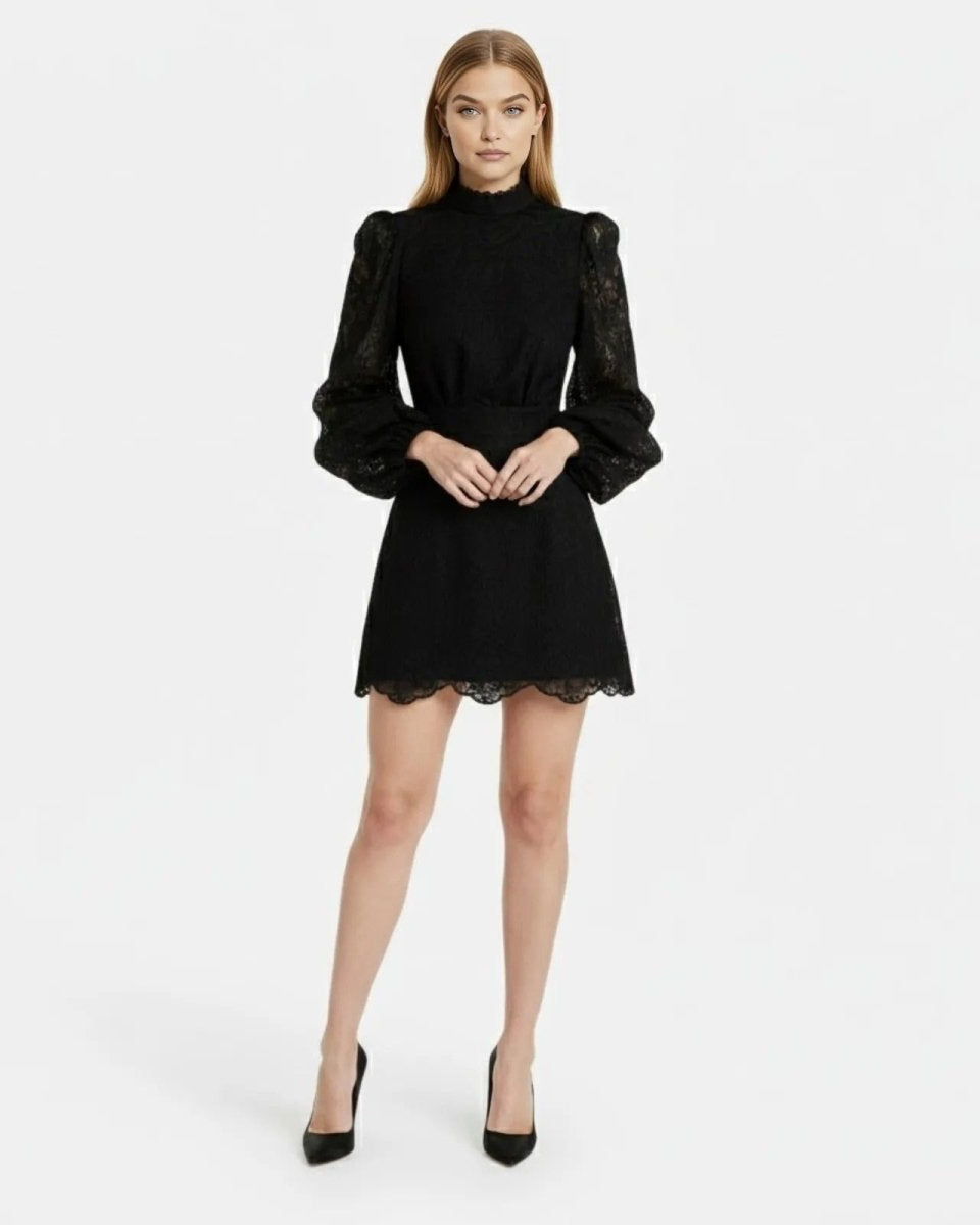 Model wearing Ondara black lace bishop sleeve mini dress for evening cocktail parties