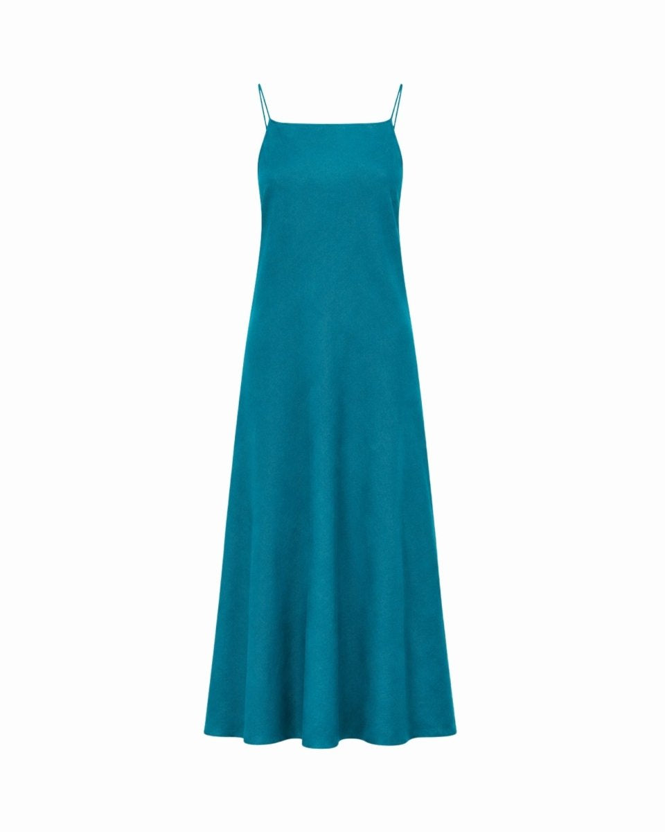 A teal blue maxi slip dress with thin spaghetti straps, shown against a plain white background.