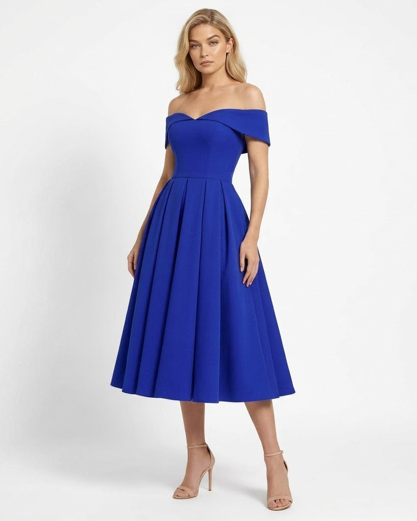 Woman wearing a blue off-shoulder dress on a white background