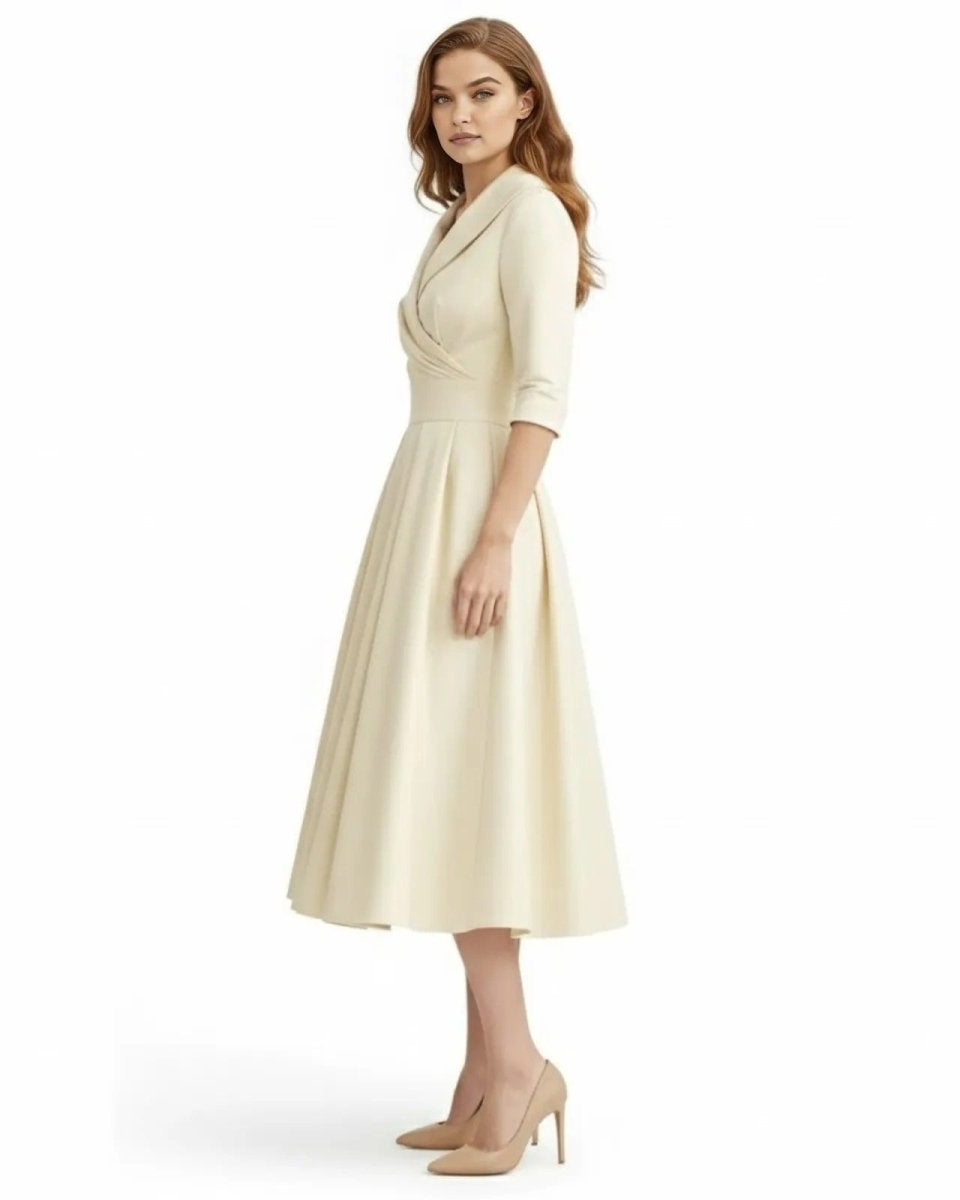Woman wearing a cream-colored dress on a white background