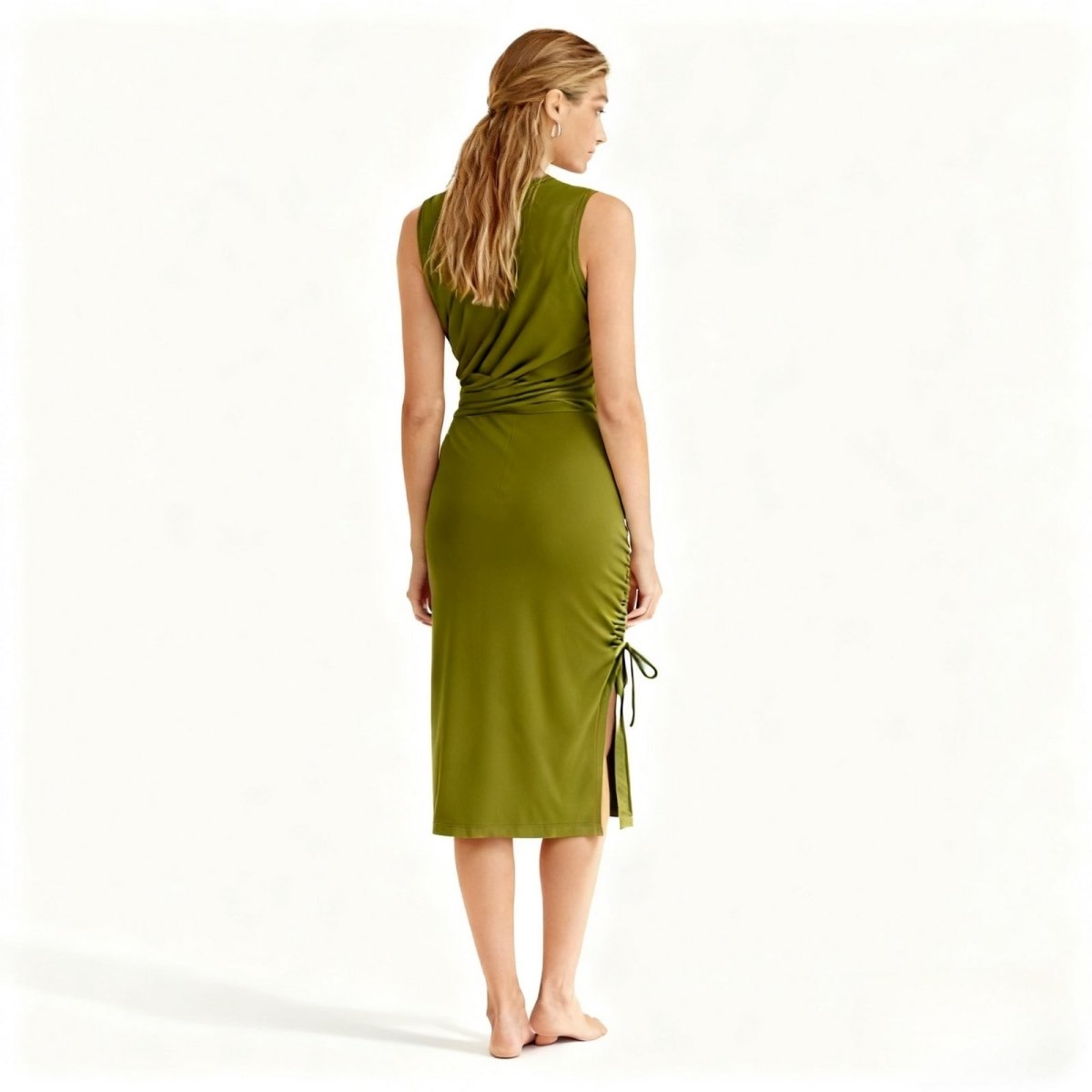 Woman wearing a green dress with a white background