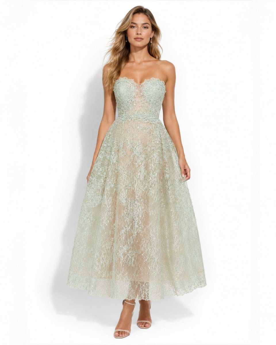 Front view of a model in the sage green strapless lace midi dress with illusion plunge detail by Ondara.