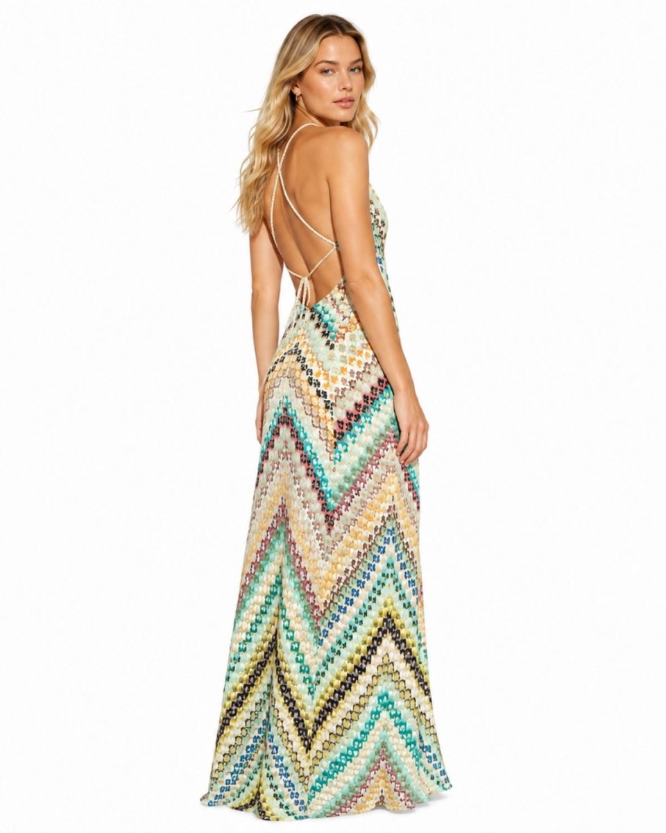 Back and side profile showing the open back and adjustable string ties of the ivory zigzag knit maxi dress.