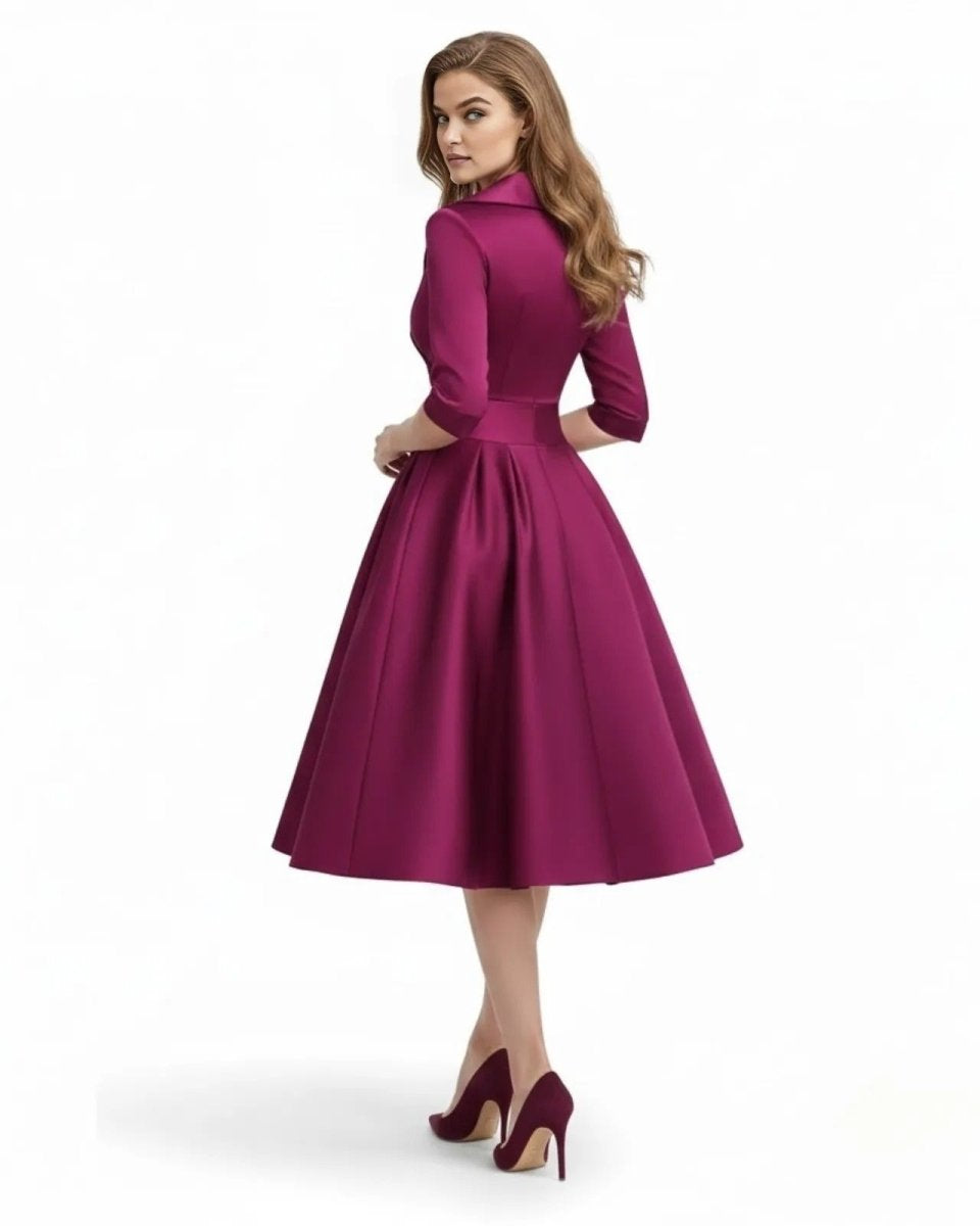 Woman wearing a magenta dress on a white background