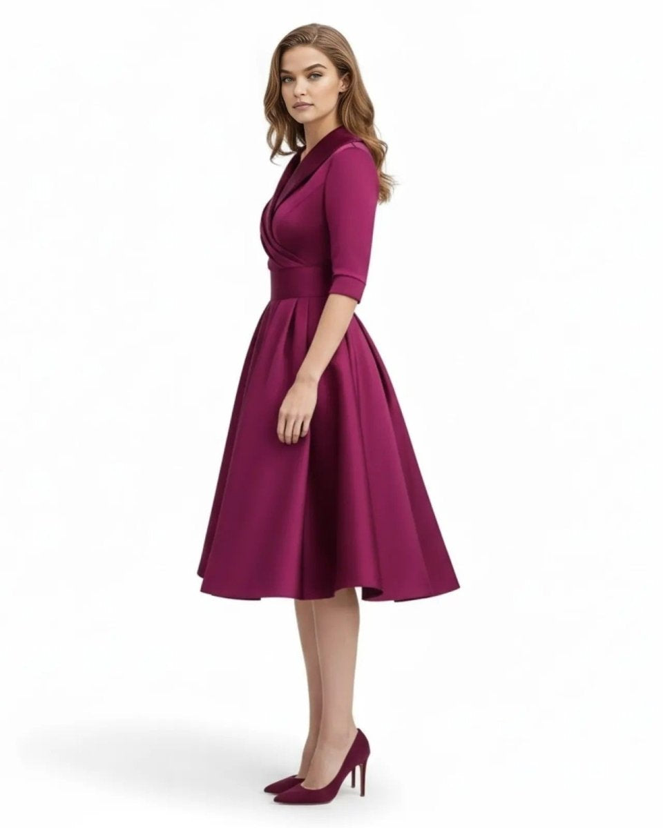 Woman wearing a magenta dress on a white background