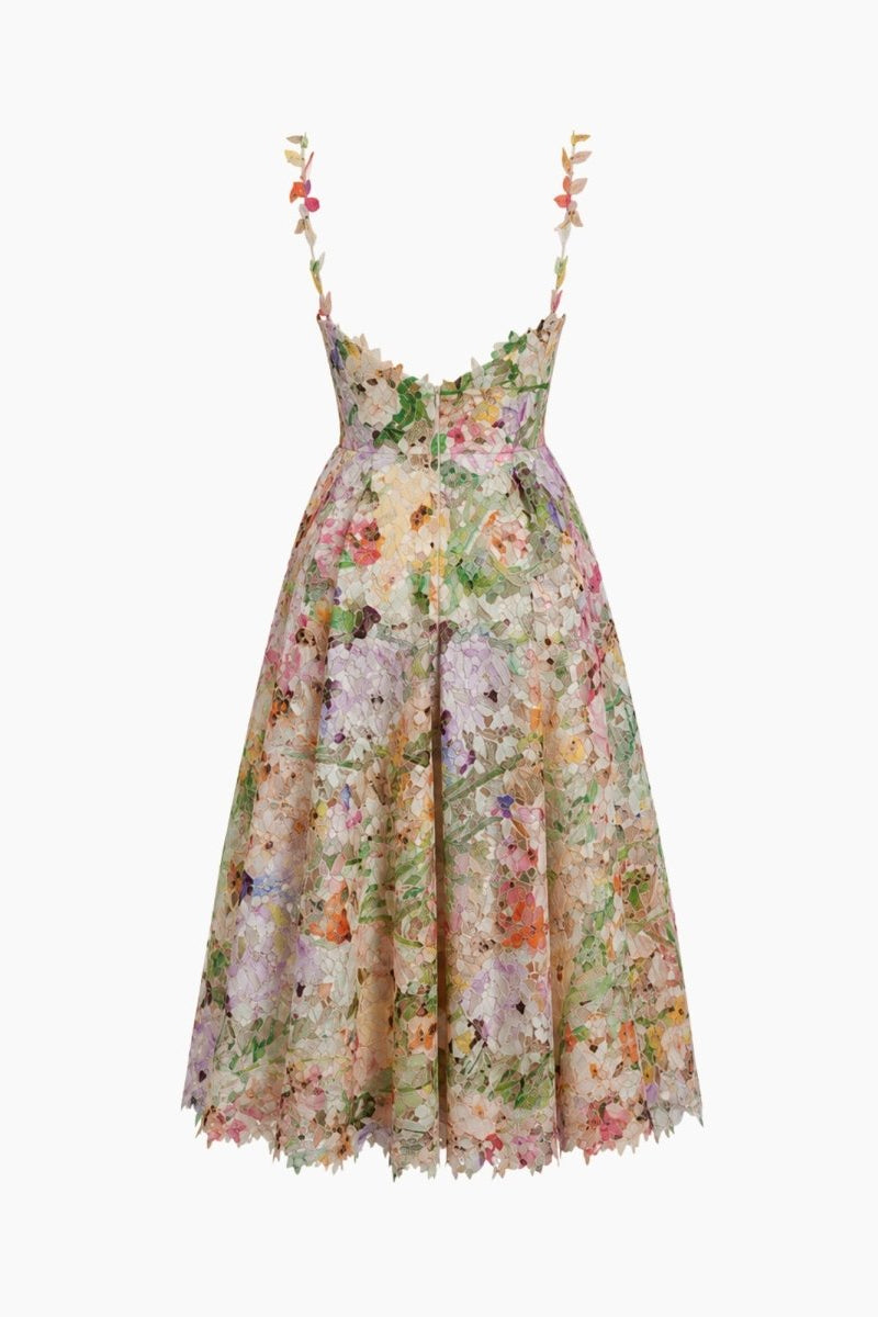Close-up detail of hand-crafted 3D botanical appliques and pastel lace fabric on Ondara dress