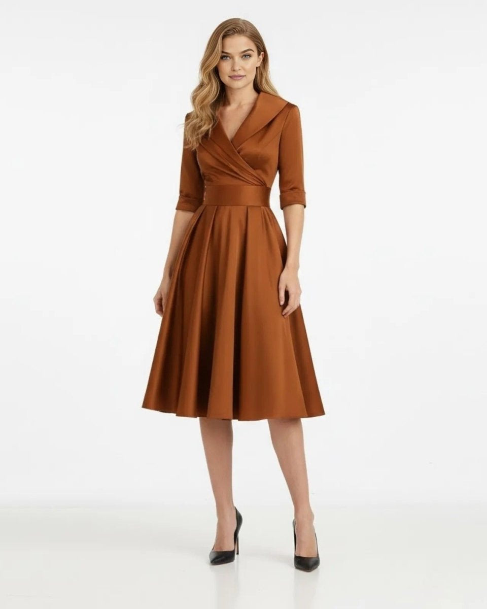 Woman wearing a brown dress on a white background