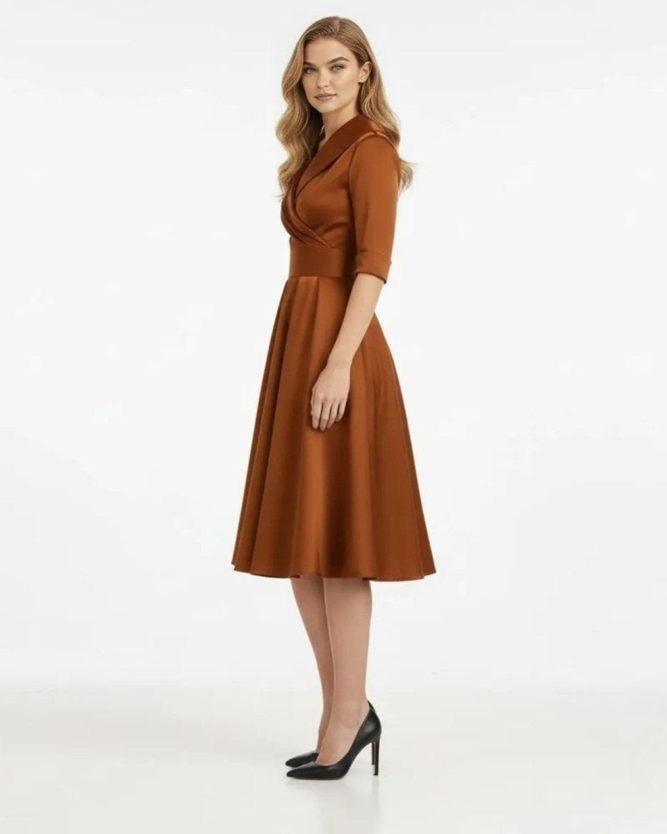 Woman wearing a brown dress on a white background