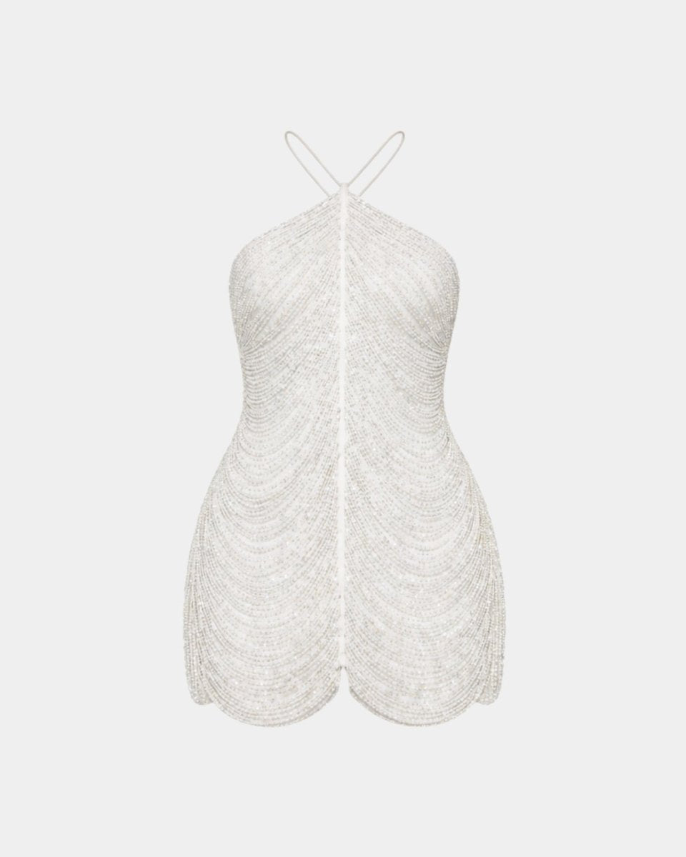 Close-up of Ondara white beaded mini dress showing premium glass bead craftsmanship and reinforced stitching.
