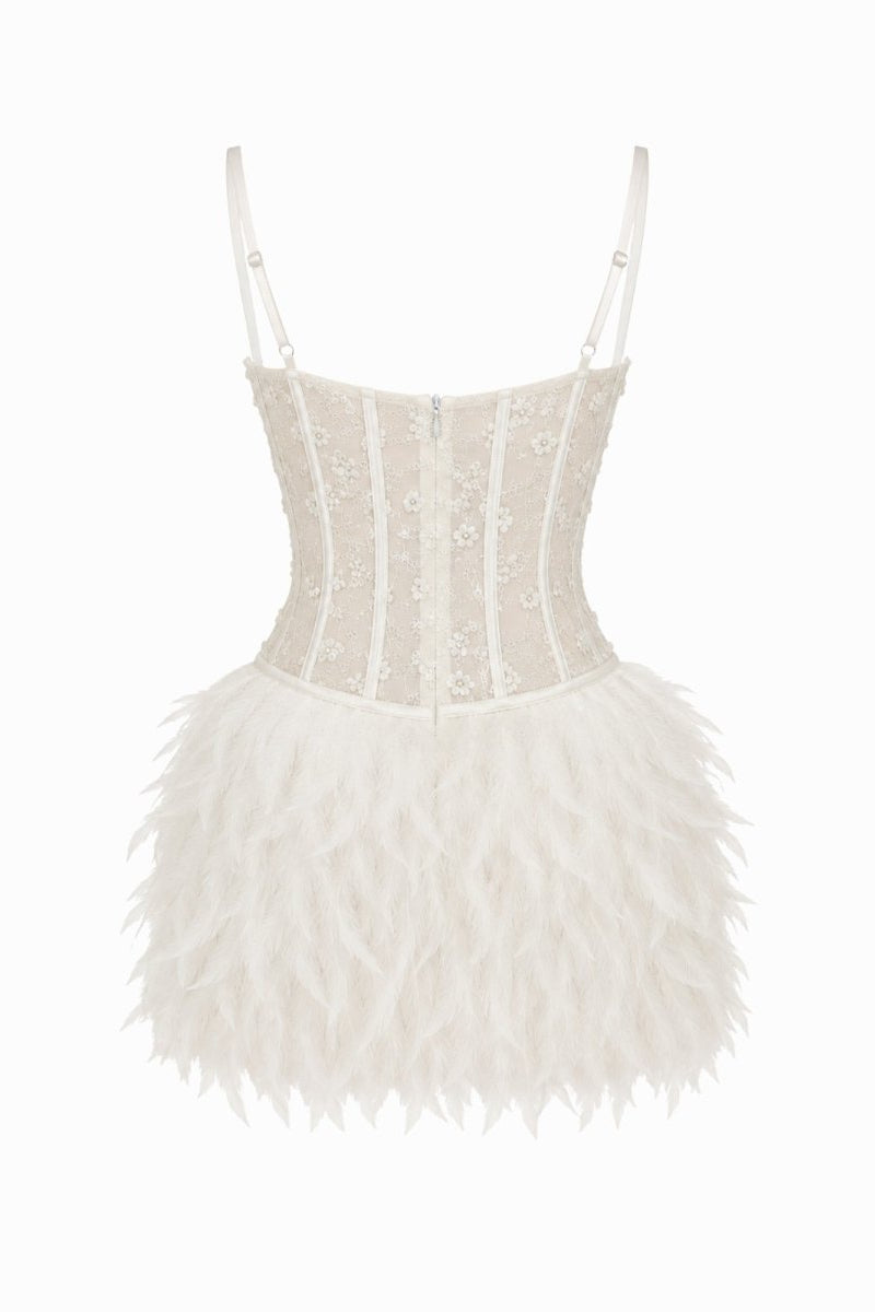 Back angle product detail of white lace corset dress with feather skirt cutout