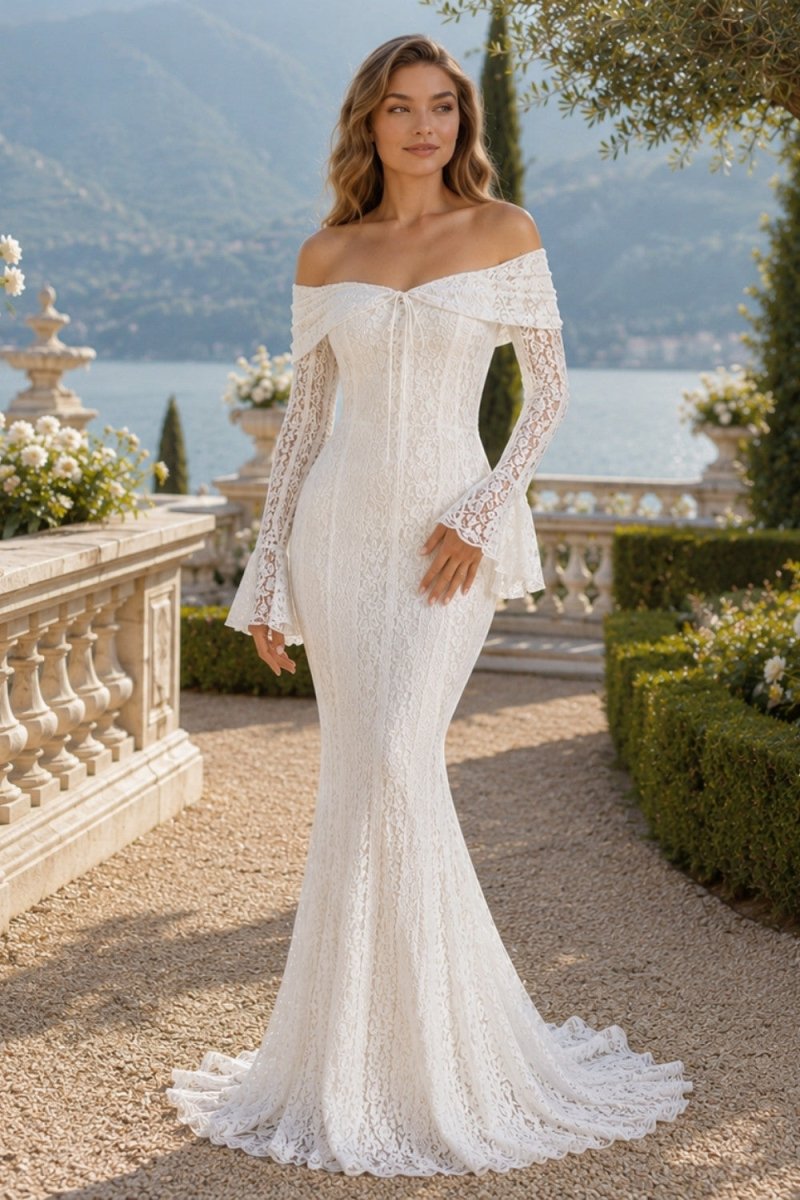 Model standing in an elegant garden wearing the Ondora Glezellia white lace off-the-shoulder dress, perfect for a bridal reception.