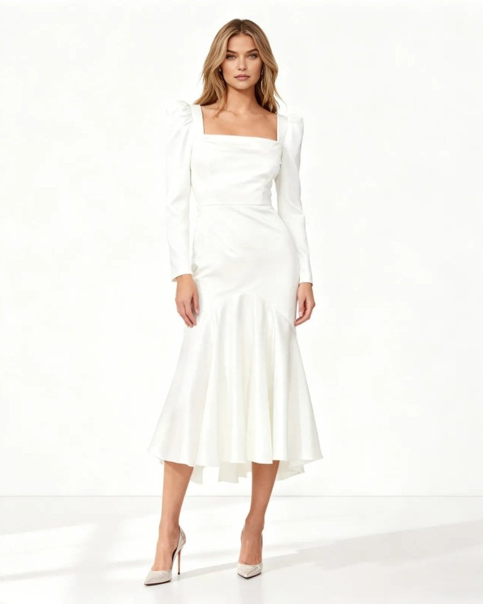 Woman wearing a white dress on a white background