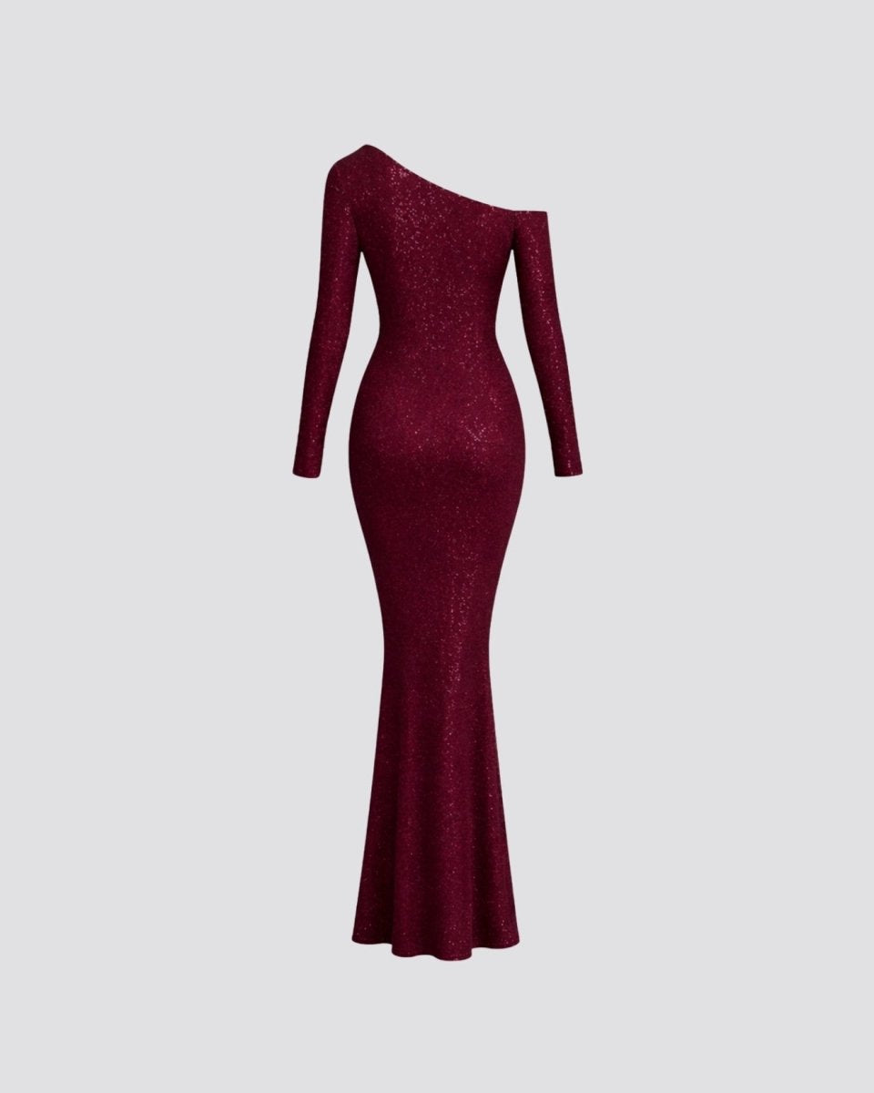 A long-sleeve, off-the-shoulder, bodycon maxi dress in deep burgundy with a sparkling textured finish, shown against a solid light gray background.