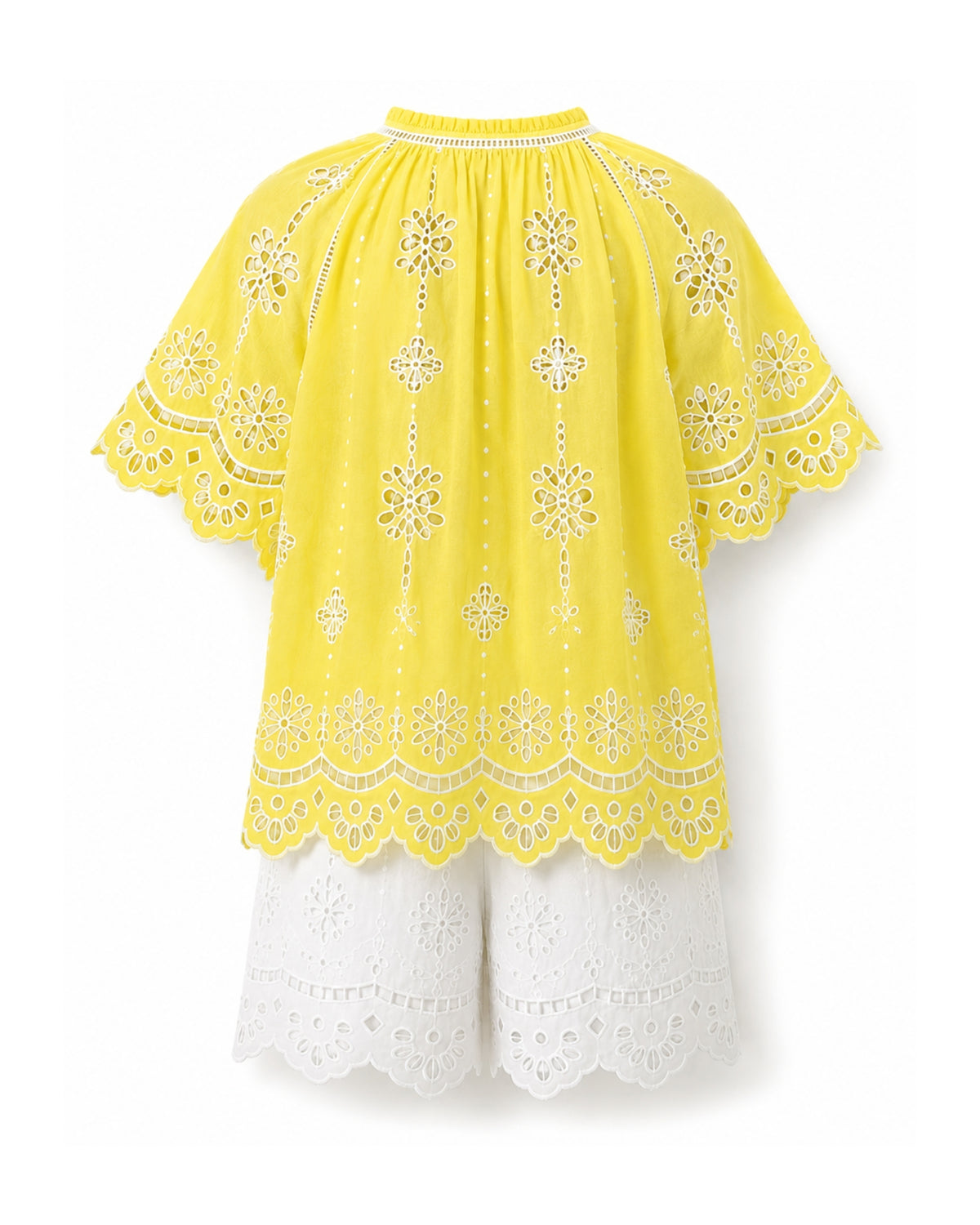 A bright yellow eyelet embroidered top with short flutter sleeves and white eyelet shorts, displayed against a solid white background.
