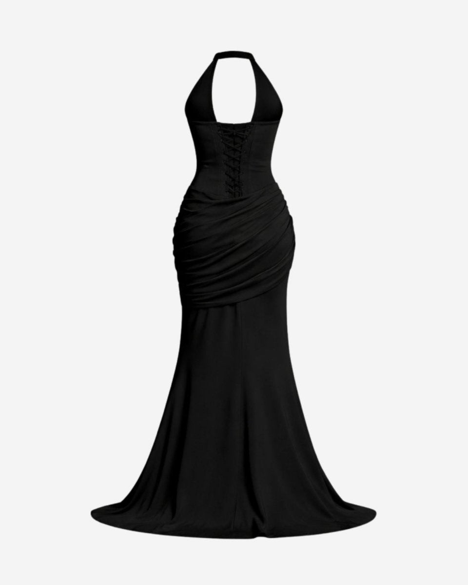 A black halter-neck floor-length gown with a structured corset-style bodice, front lace-up detail, and draped ruching around the waist, shown against a plain light gray background.