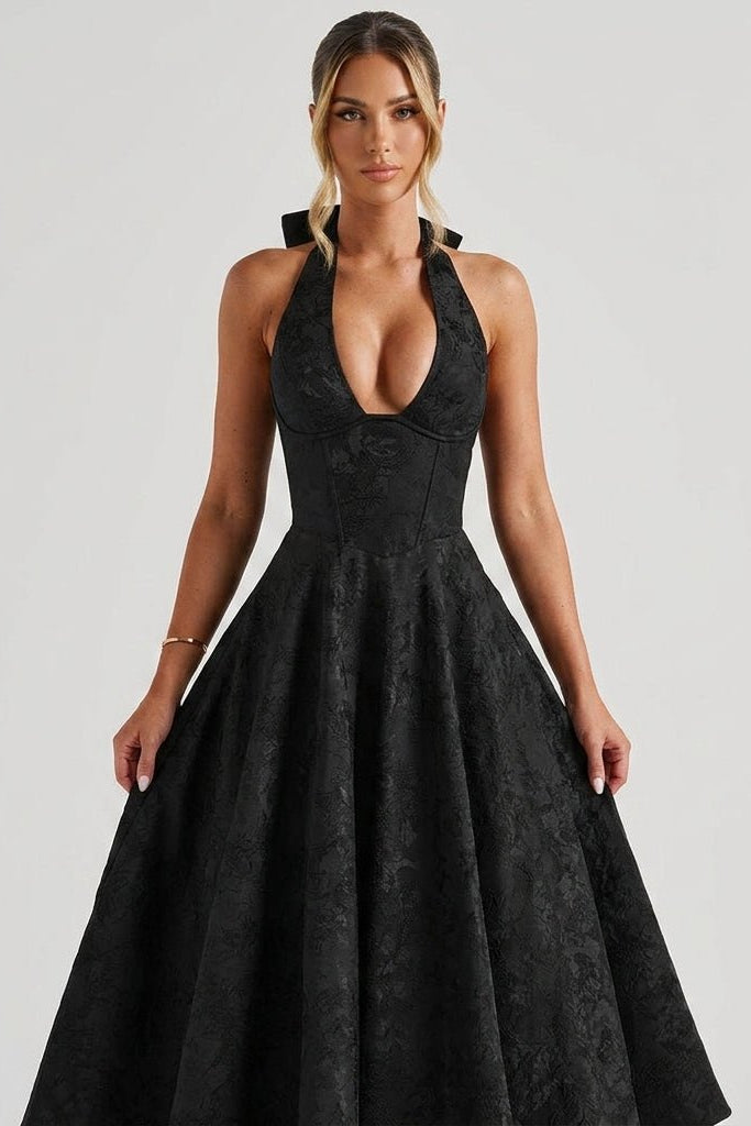 Close-up detail of the black plunging V-neck bustier and textured floral jacquard fabric on the Ondara midi dress.