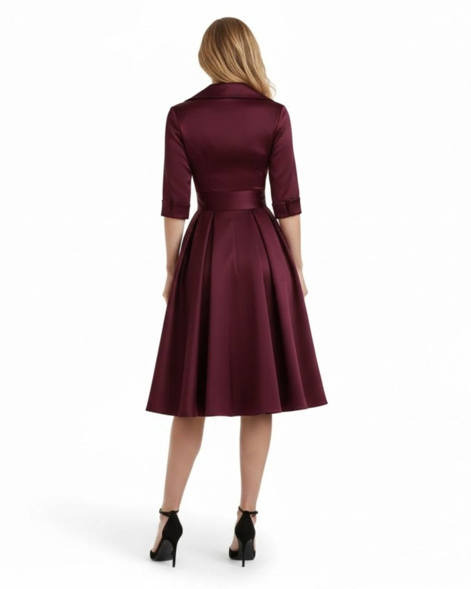 Maroon dress worn by a model on a white background