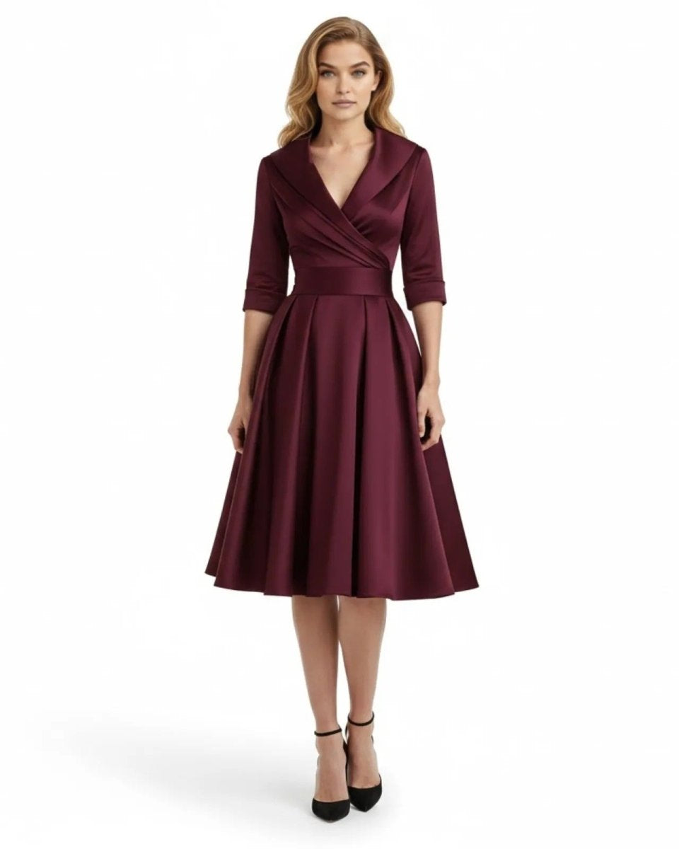 Woman wearing a burgundy dress on a white background