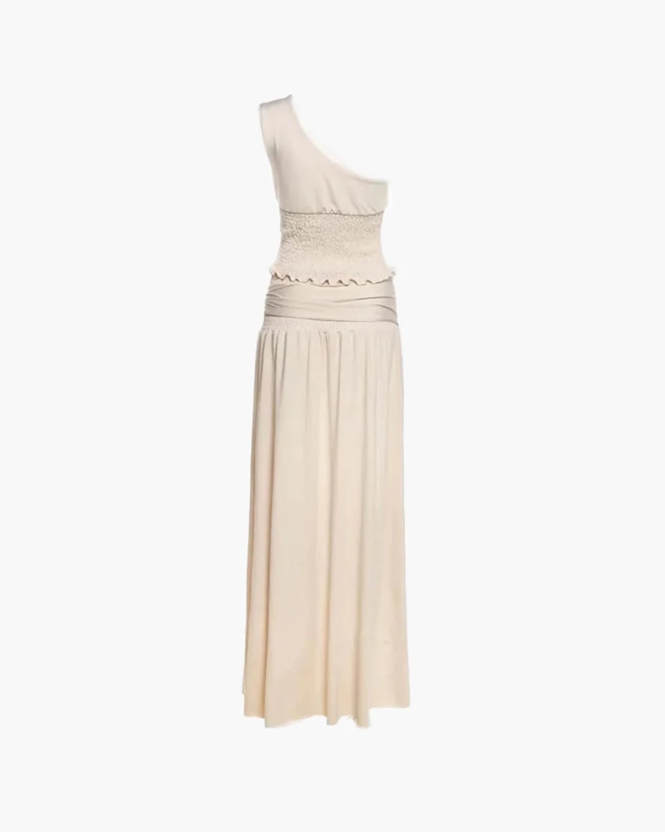 Product shot of the Ondara beige belted maxi skirt set featuring a one-shoulder top and metal buckle detail.