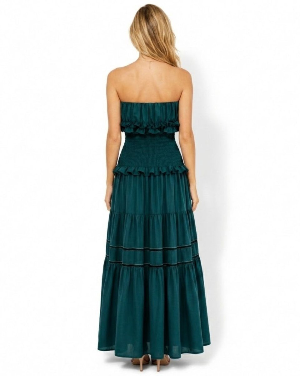 Back view of the dark green strapless smocked bodice maxi dress demonstrating the form-fitting, slip-free stretch design.