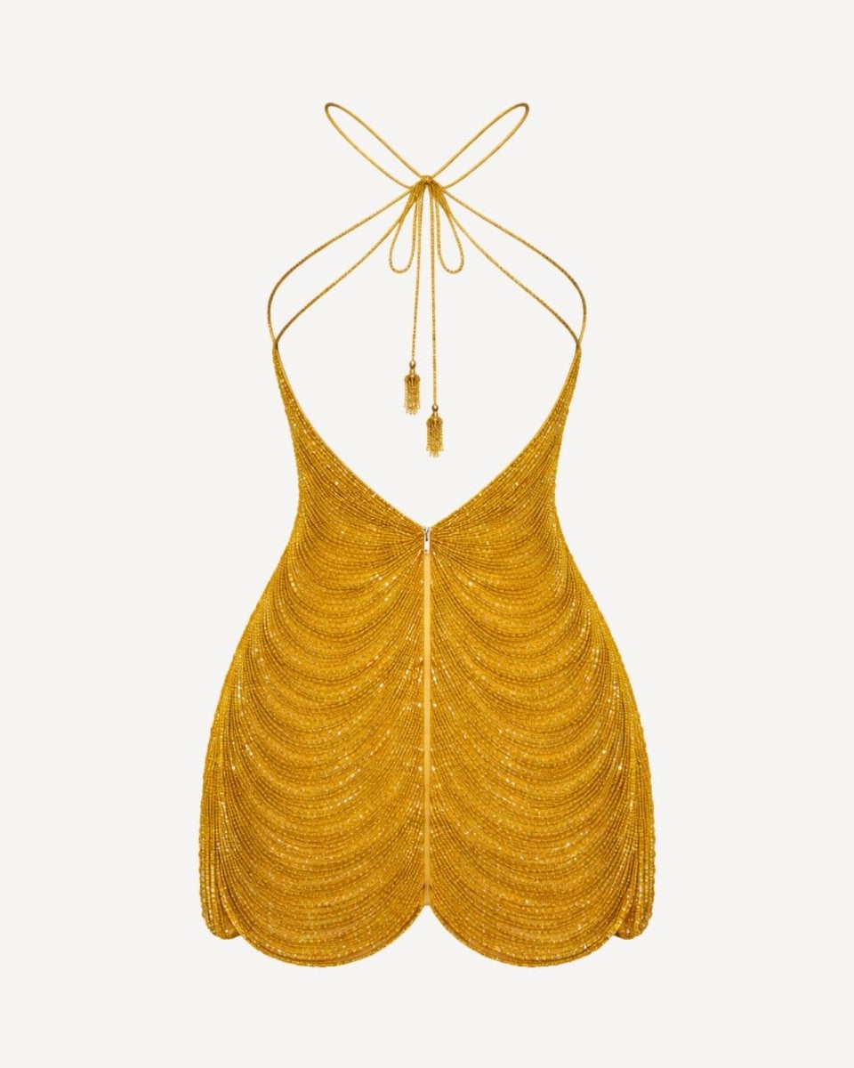 Gold beaded halter top on a white background