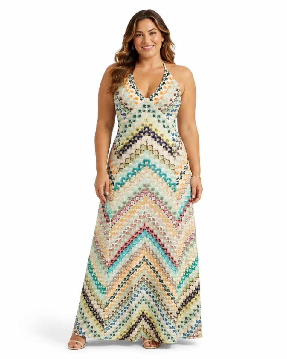Plus size model confidently posing in the Ondara ivory multicolor boho chevron knit maxi dress.