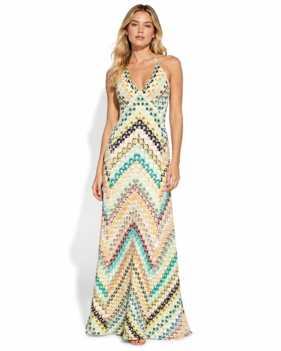 Front view of woman wearing the Ondara ivory multicolor chevron knit halter maxi dress with plunge V-neck.