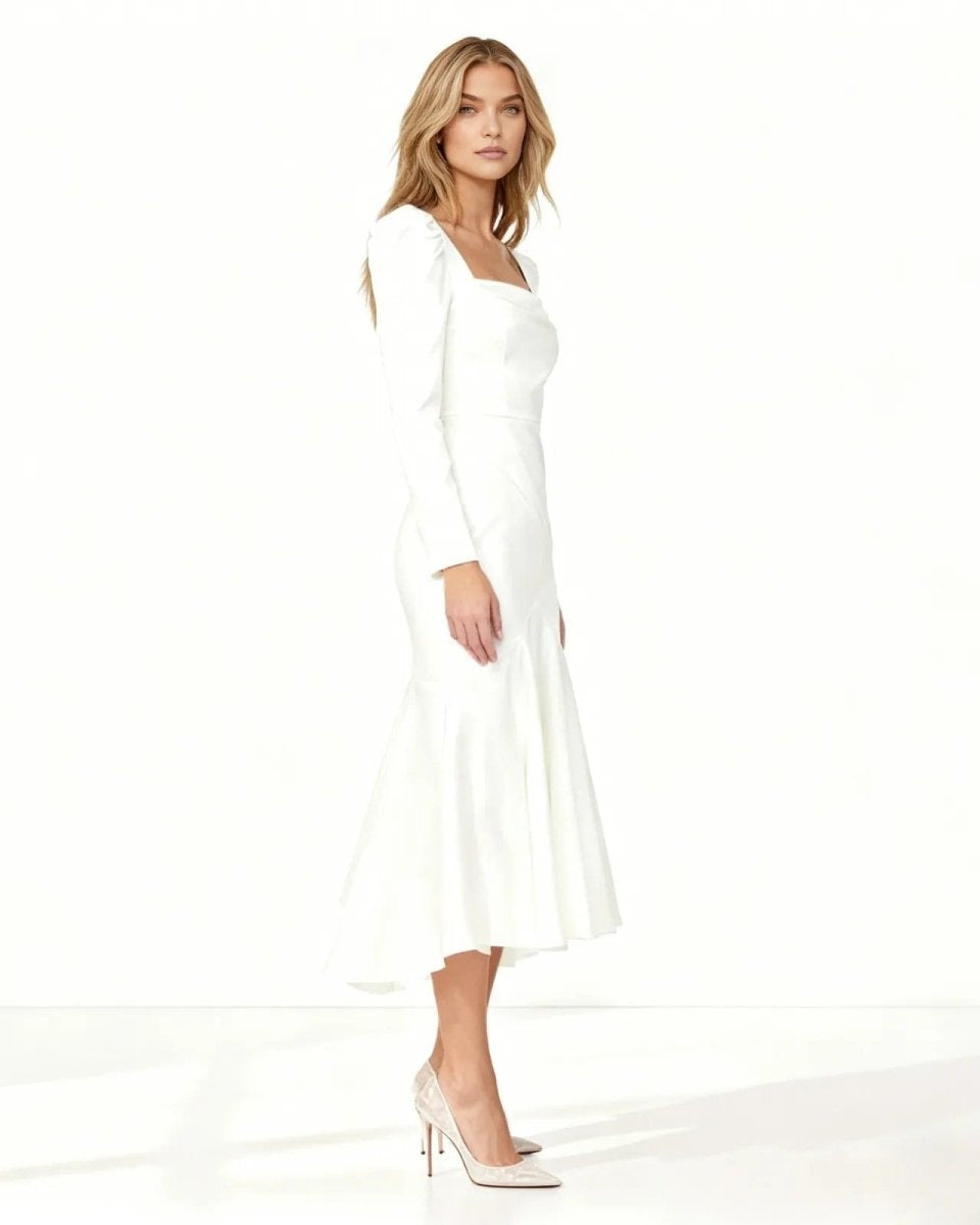 Woman wearing a white dress on a white background