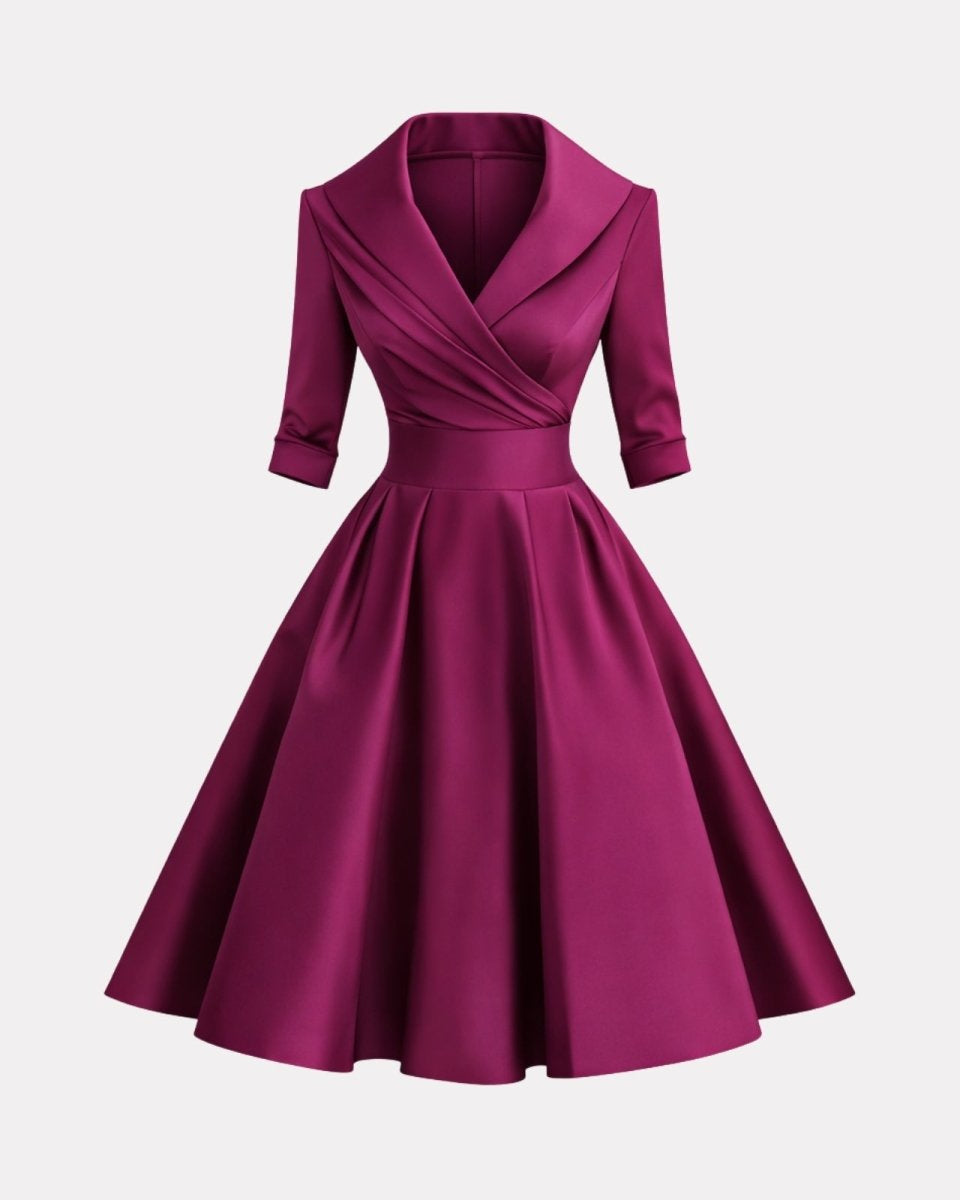 Purple dress with a V-neckline and short sleeves on a light gray background