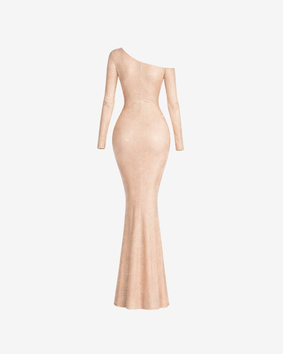 A shimmering, one-shoulder floor-length gown in a light champagne pink color, displayed on a ghost mannequin against a plain light gray background.