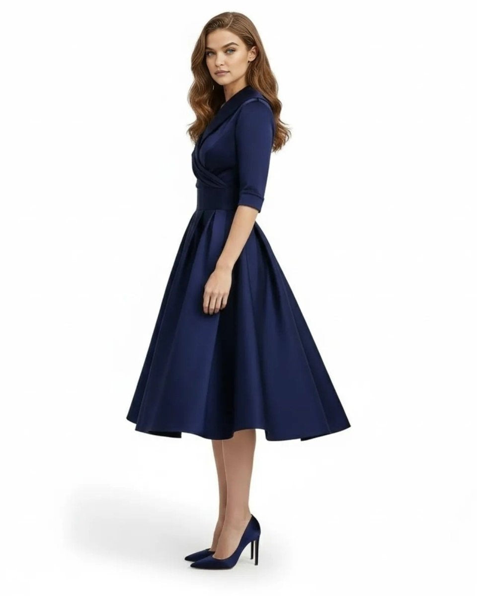 Woman wearing a navy blue dress on a white background