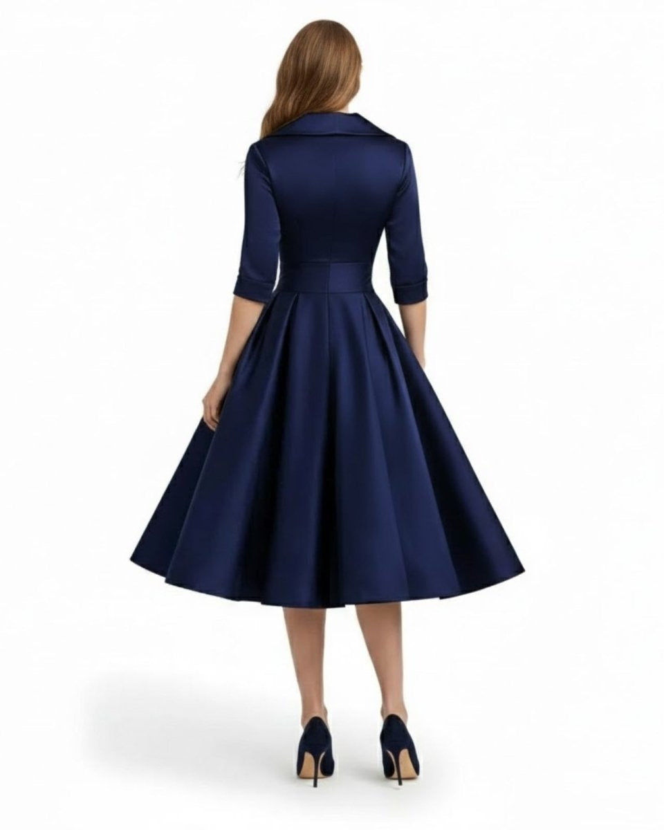 Navy blue dress with a belt on a white background