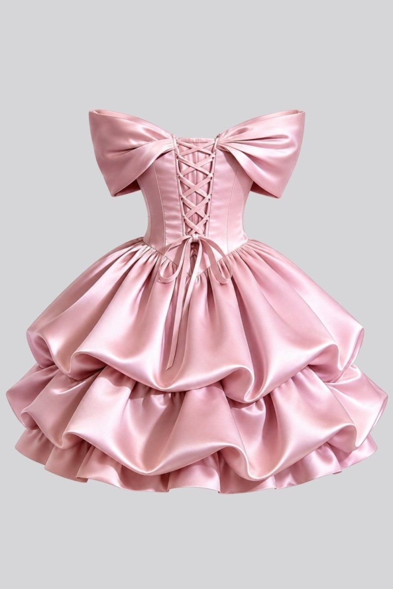 Back flatlay view of the Ondora Cosette pink satin mini dress showing the lace-up corset back and tiered ruffle skirt.