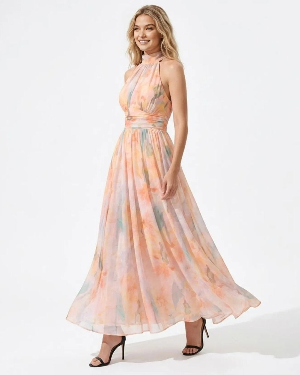 Side profile of a woman modeling the flowing Ondara pastel watercolor chiffon maxi gown.