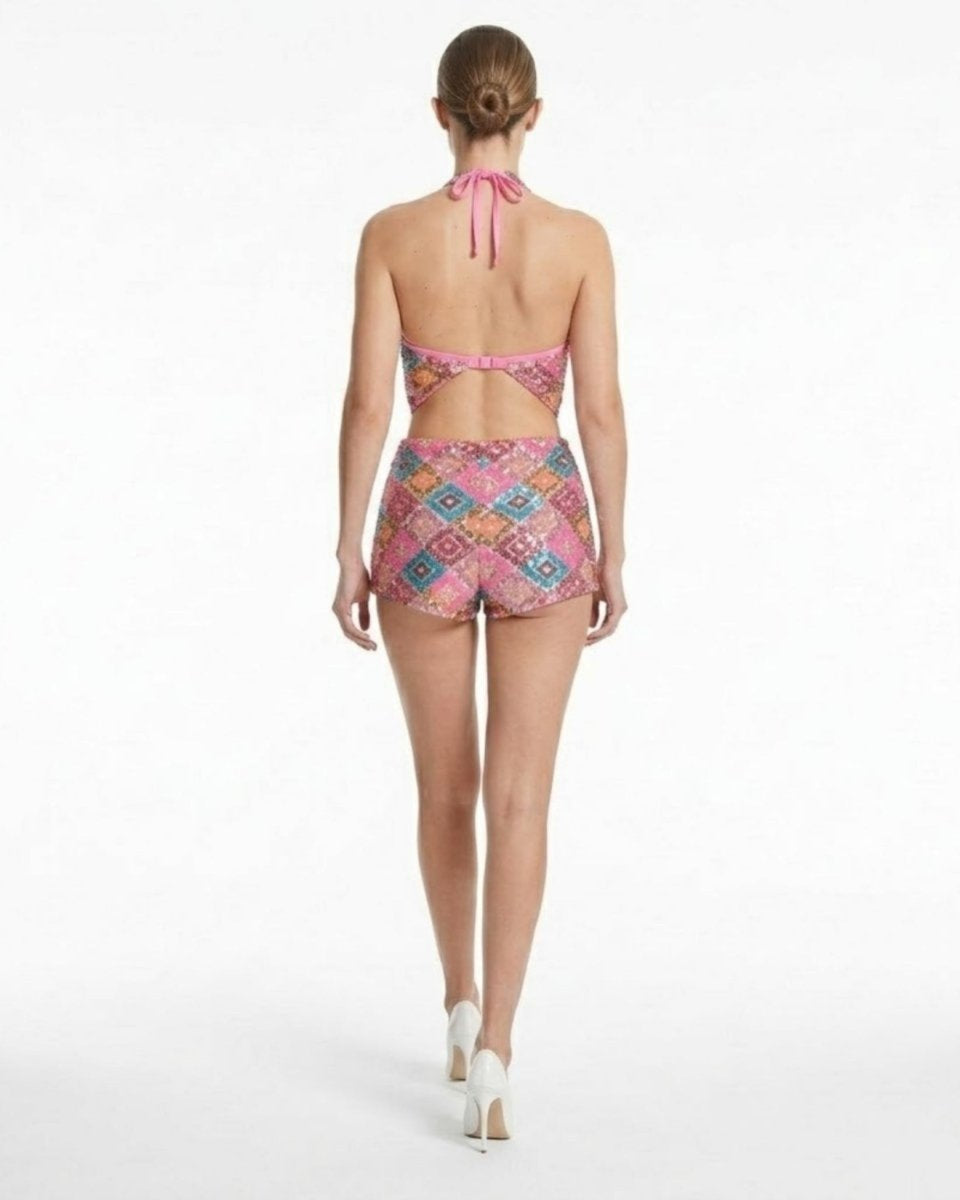 Woman wearing a colorful patterned bikini on a white background