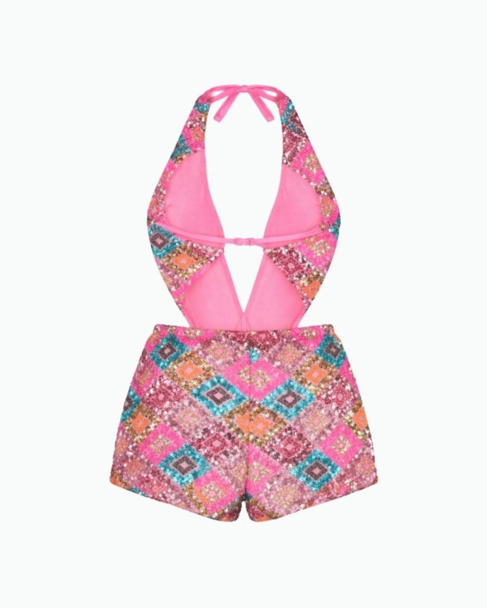 Two-piece swimsuit with pink top and patterned shorts on a white background
