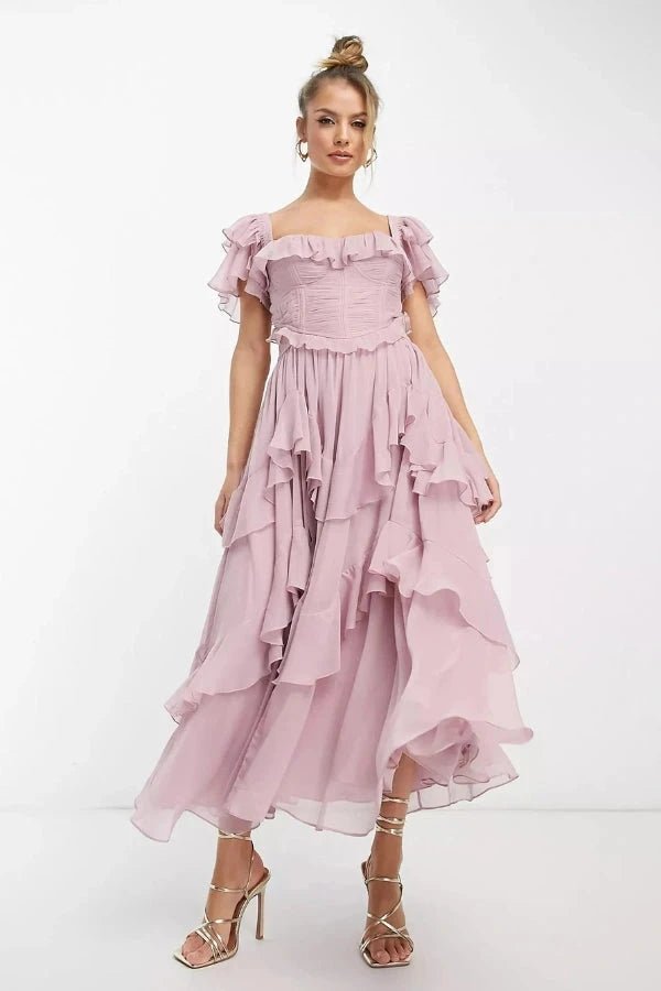 Front view of Ondara luxury dusty pink ruffle corset two-piece maxi dress set worn by model