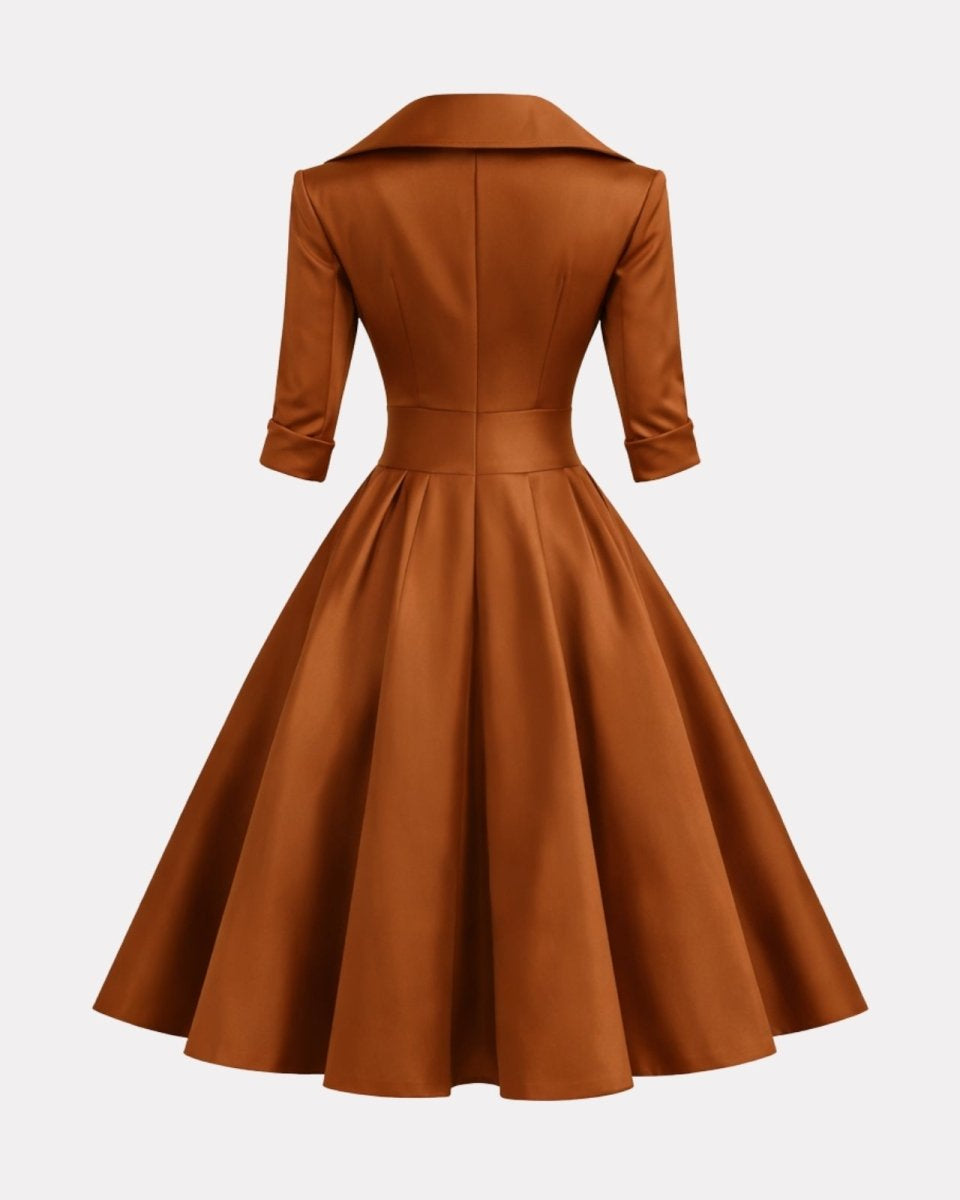 Brown dress with a fitted bodice and full skirt on a light gray background