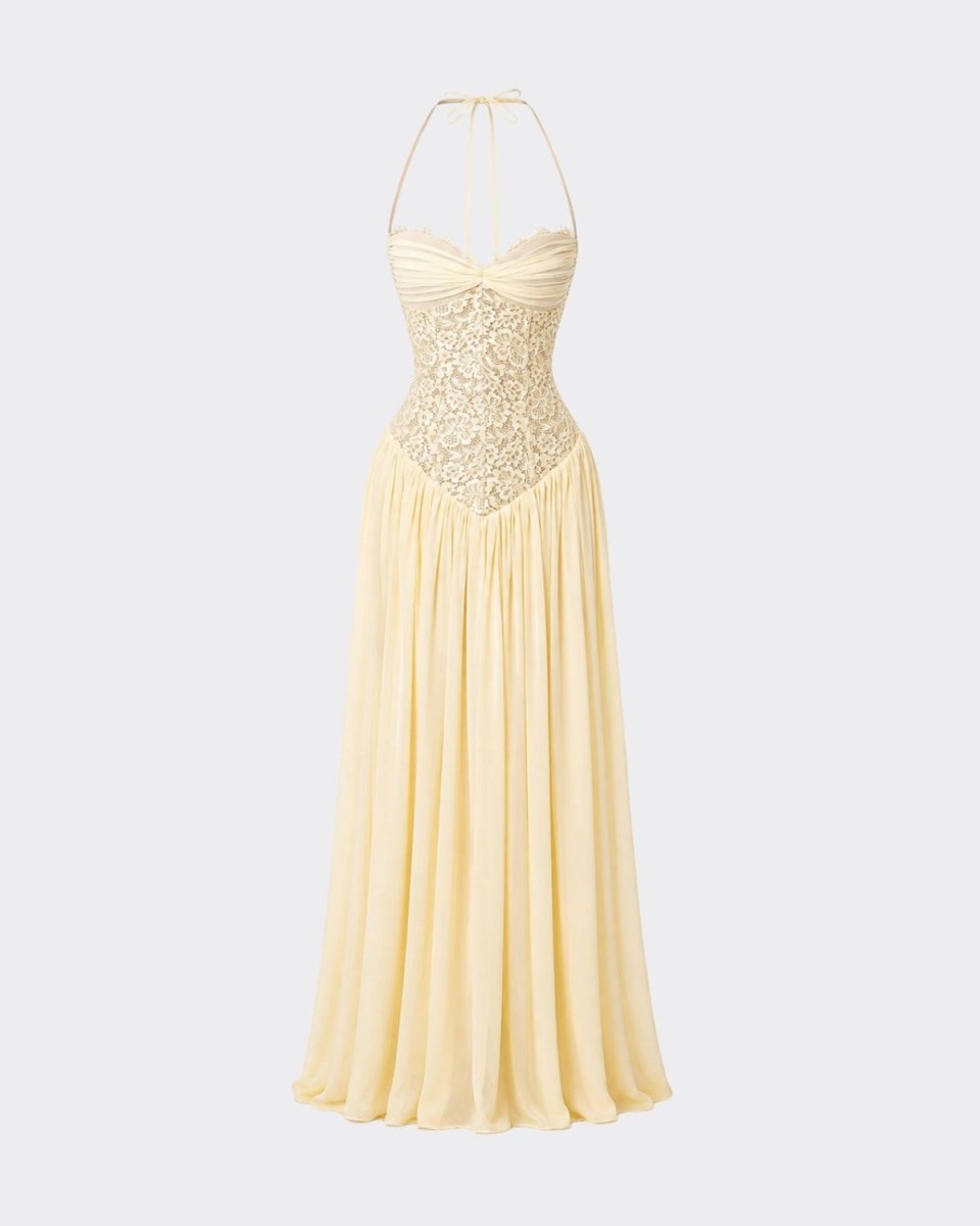 Flat lay product shot of the Ondara yellow bustier halter prom dress, displaying the intricate floral lace bodice and sweeping maxi skirt.
